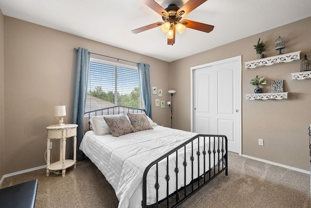 carpeted bedroom featuring baseboards, ceiling fan, and a closet