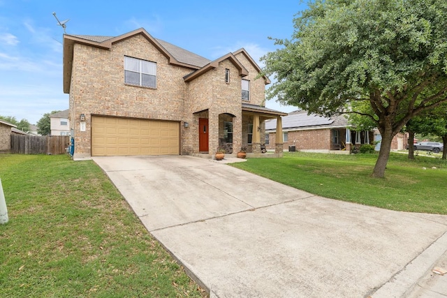 traditional home with brick siding, an attached garage, fence, and driveway