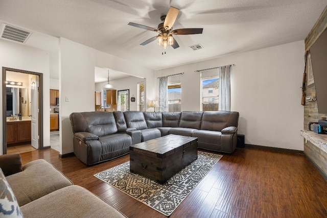 12616 Wayne Spur Ln, Elgin, TX 78621 - living area with a ceiling fan, healthy amount of natural light, wood finished floors, and baseboards