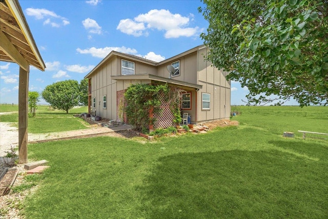 2334 County Road 464, Elgin, TX 78621 - view of property exterior featuring board and batten siding and a yard