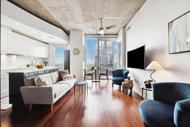 living room featuring dark wood-style flooring and visible vents