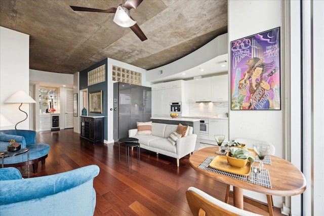 living room featuring a ceiling fan, dark wood-style flooring, and beverage cooler