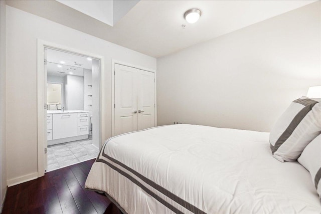bedroom featuring recessed lighting, hardwood / wood-style floors, and connected bathroom