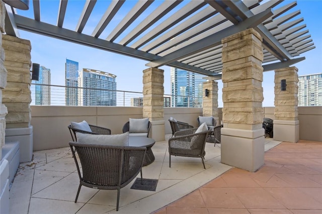 view of patio with a view of city, a pergola, and an outdoor living space