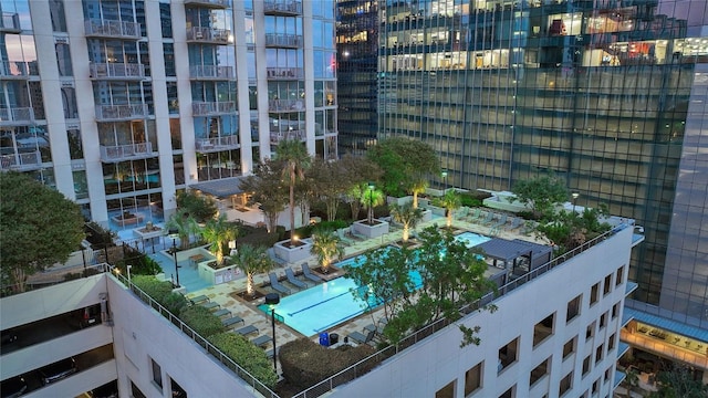 view of home's community with a view of city and a swimming pool