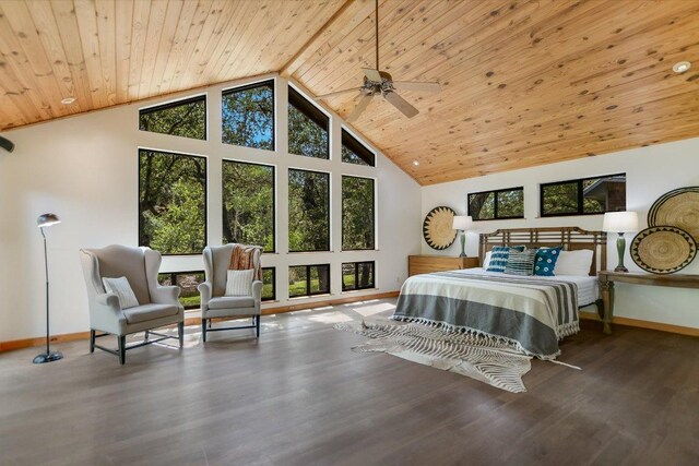 bedroom featuring baseboards, wood finished floors, high vaulted ceiling, and wooden ceiling