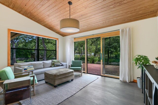 living area with wooden ceiling, wood finished floors, and lofted ceiling