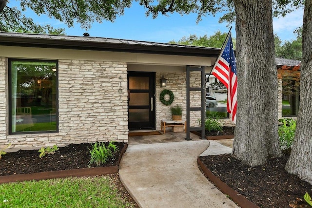view of exterior entry with stone siding