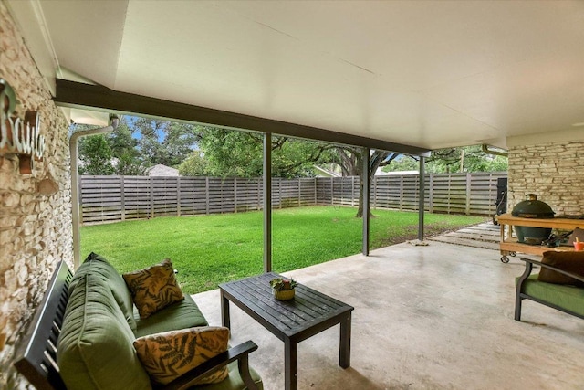 view of patio featuring a fenced backyard, a grill, and outdoor lounge area