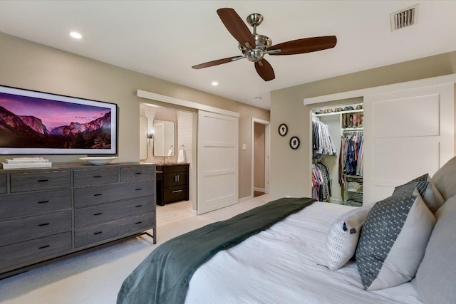 bedroom featuring a ceiling fan, visible vents, a closet, ensuite bathroom, and recessed lighting