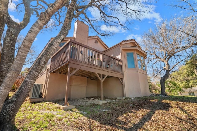 3605 Fawn Creek Path, Austin, TX 78746 - rear view of house featuring a wooden deck and stucco siding