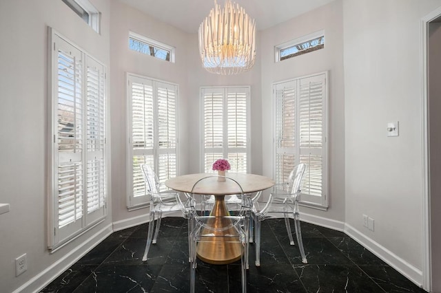3605 Fawn Creek Path, Austin, TX 78746 - dining space featuring dark marble finish floors, a chandelier, and a high ceiling