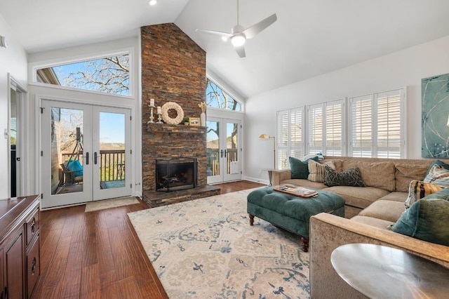3605 Fawn Creek Path, Austin, TX 78746 - living area featuring french doors, high vaulted ceiling, dark wood-type flooring, a ceiling fan, and a stone fireplace