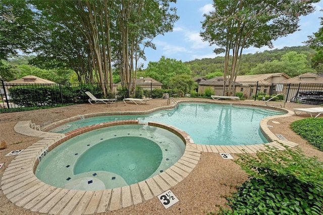 3605 Fawn Creek Path, Austin, TX 78746 - view of pool with a pool with connected hot tub and a patio