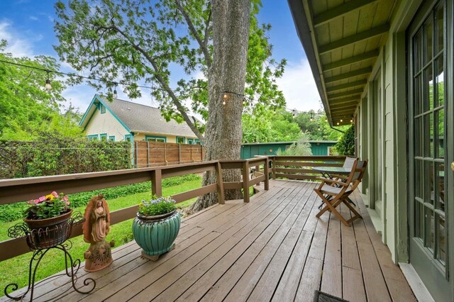 wooden deck featuring fence