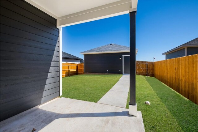 view of yard featuring a fenced backyard and a patio area