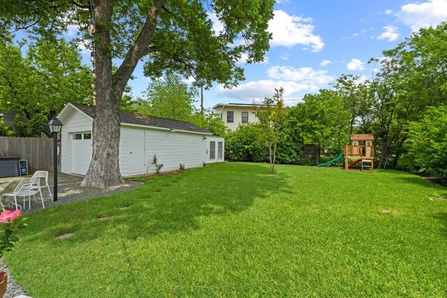 view of yard featuring a playground and fence