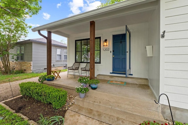 doorway to property featuring a porch