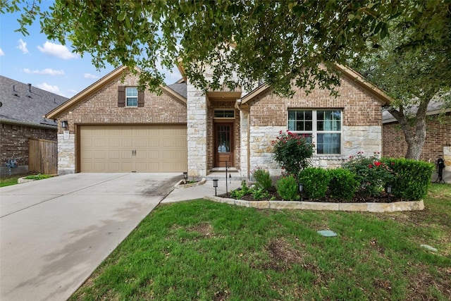 view of front of home with a front yard, a garage, fence, concrete driveway, and stone siding