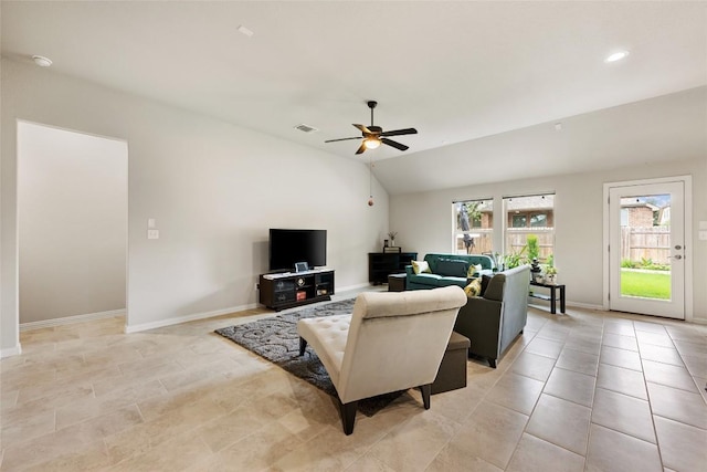 living area with ceiling fan, baseboards, light tile patterned floors, lofted ceiling, and visible vents
