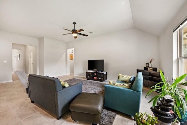 living area featuring visible vents, light tile patterned flooring, baseboards, a ceiling fan, and vaulted ceiling