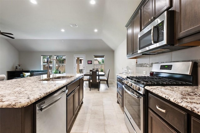 kitchen featuring stainless steel appliances, recessed lighting, a healthy amount of sunlight, and a sink