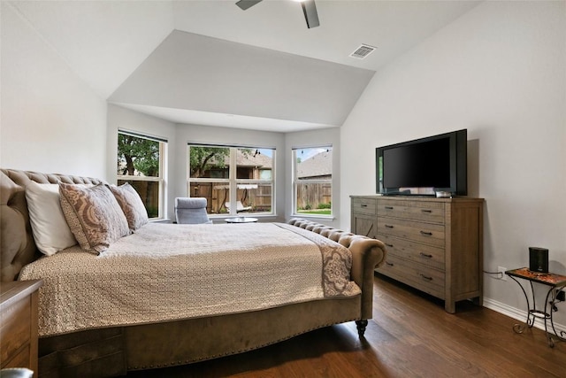bedroom with ceiling fan, visible vents, vaulted ceiling, dark wood finished floors, and baseboards
