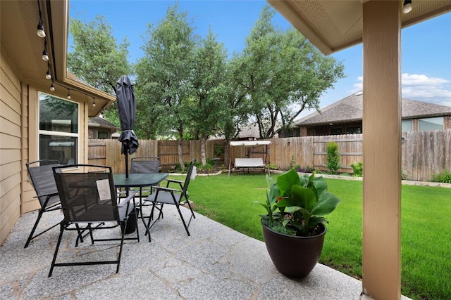 view of patio / terrace with a fenced backyard and outdoor dining space