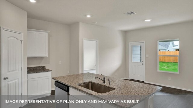 kitchen with stainless steel dishwasher, visible vents, light stone countertops, white cabinetry, and a sink