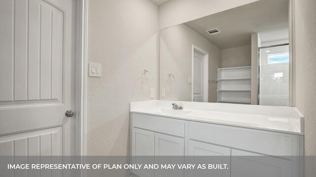 bathroom featuring vanity and visible vents