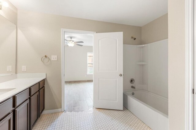 bathroom featuring a ceiling fan, shower / bath combination, and vanity