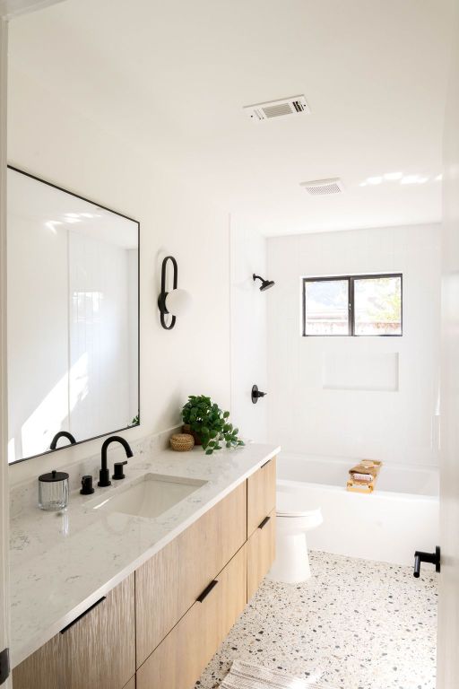 10502 Ronwood Dr, Austin, TX 78750 - full bath featuring vanity, toilet, and speckle patterned floor