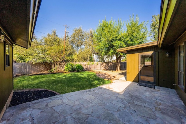 view of yard featuring a patio and a fenced backyard