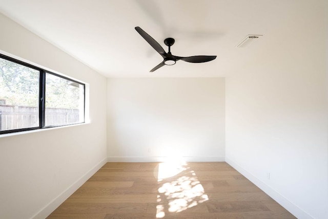 10502 Ronwood Dr, Austin, TX 78750 - empty room with light wood-style floors, ceiling fan, and baseboards
