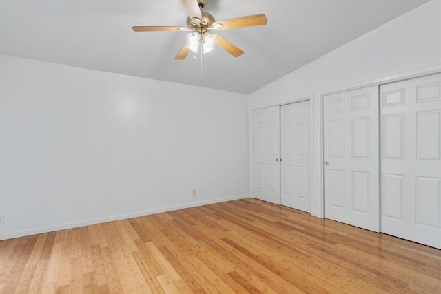 1304 Mariposa Dr Unit 231, Austin, TX 78704 - unfurnished bedroom with vaulted ceiling, multiple closets, light wood finished floors, baseboards, and ceiling fan