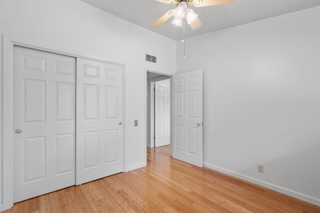 unfurnished bedroom featuring visible vents, baseboards, and light wood-style floors