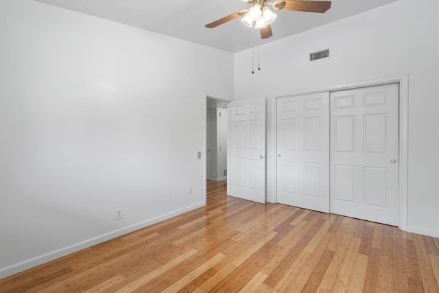 1304 Mariposa Dr Unit 231, Austin, TX 78704 - unfurnished bedroom with light wood finished floors, baseboards, a closet, and a ceiling fan