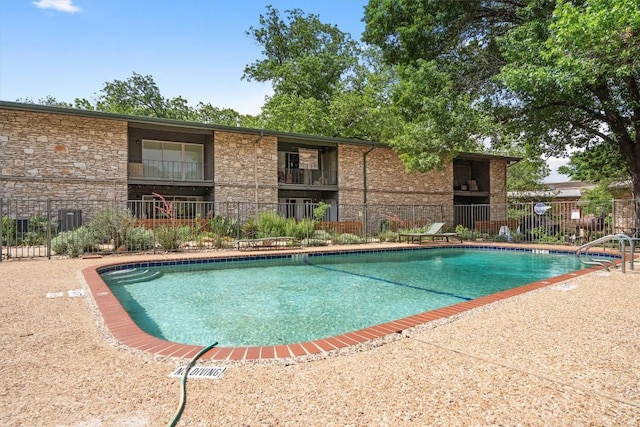 1304 Mariposa Dr Unit 231, Austin, TX 78704 - community pool featuring fence
