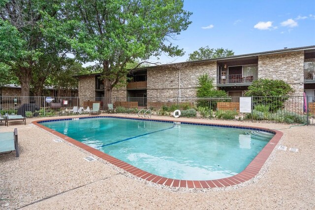 community pool with fence