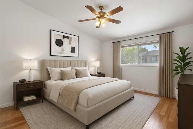 1304 Mariposa Dr Unit 231, Austin, TX 78704 - bedroom featuring vaulted ceiling, light wood-style flooring, baseboards, and a ceiling fan