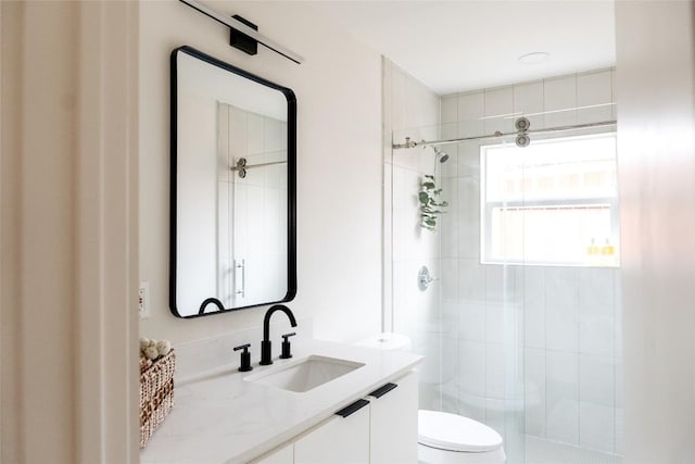5731 Wellington Dr, Austin, TX 78723 - bathroom featuring toilet, a stall shower, and vanity