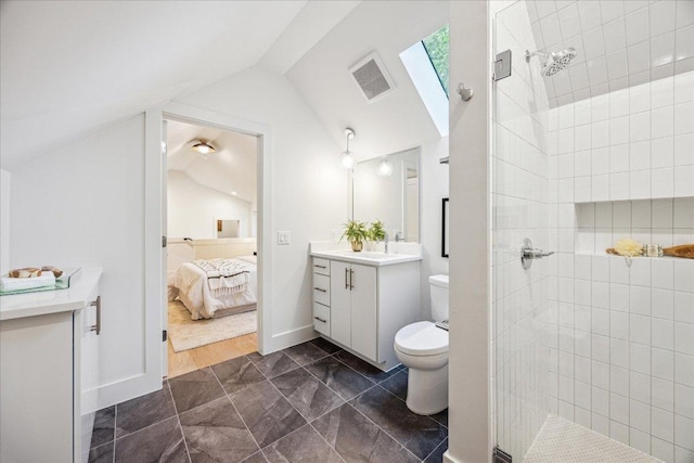 bathroom with visible vents, vaulted ceiling, toilet, and vanity