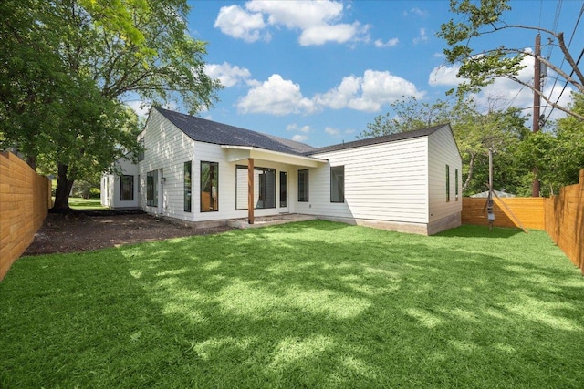 view of yard featuring a patio and a fenced backyard
