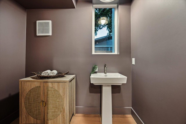 4708 Philco Dr, Austin, TX 78745 - bathroom with wood finished floors and baseboards