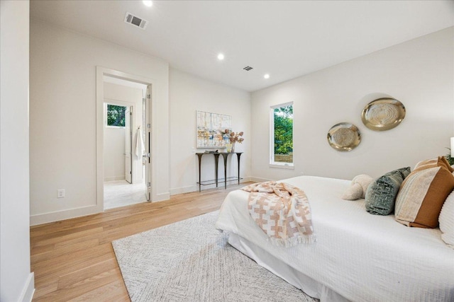 4708 Philco Dr, Austin, TX 78745 - bedroom with wood finished floors, multiple windows, and recessed lighting
