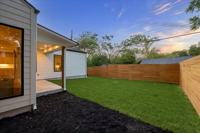 view of yard with a fenced backyard and a patio