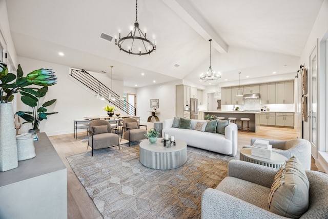 4708 Philco Dr, Austin, TX 78745 - living area featuring a chandelier, recessed lighting, stairs, and light wood finished floors