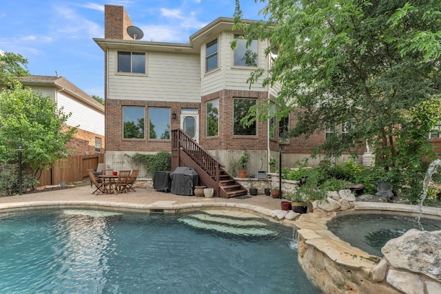 10636 Bramblecrest Dr, Austin, TX 78726 - back of house featuring brick siding, a chimney, and a patio