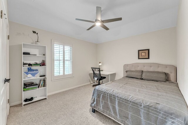 carpeted bedroom with baseboards and a ceiling fan