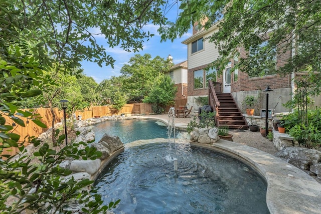 10636 Bramblecrest Dr, Austin, TX 78726 - view of pool with a fenced backyard, stairs, and a pool with connected hot tub